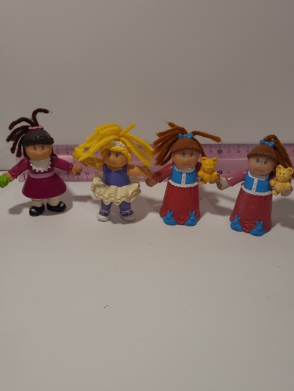 Set of Four Kids Yarn-Hair Dolls in Pink, Yellow and Blue